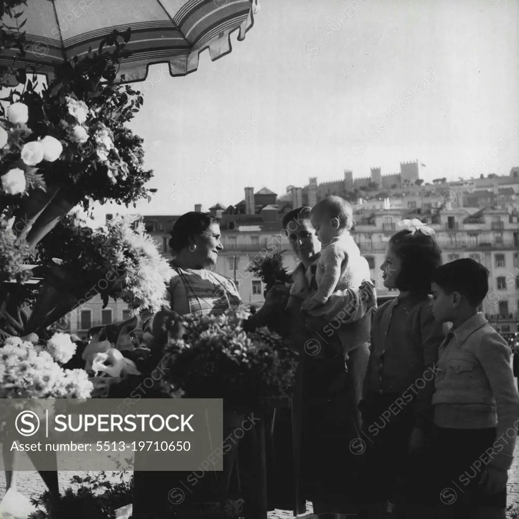 Lisbon 1952 -- The Castle of St. George, an old Moorish citadel, seen from the Lisbon flower market. February 27, 1952. (Photo by Sequeira, Camera Press).