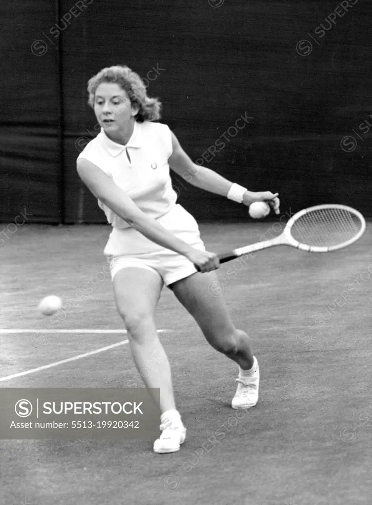 All England Lawn Tennis Championships At Wimbledon -- Lea Pericoli, of Italy, who was partnered Mrs. M. Migliori, in play in their doubles match against Mrs. J. ***** and Miss D.R. Hard. June 24, 1955. (Photo by Fox Photos).