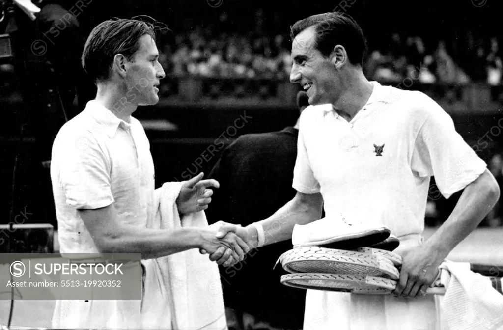 Perry Champion StillVon Cramm (right) congratulating F.J. Perry on the court after his victory at Wimbledon today July 5.F.J. Perry, of Great Britain, retained his Lawn Tennis championship at Wimbledon today July 5, when he defeated Baron Gottfried Von Cramm(Germany) in three straight sets in the final of the men's singles. August 19, 1935. (Photo by Associated Press Photo).
