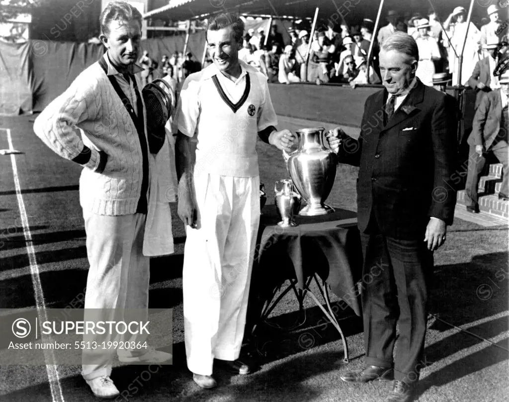 Perry Gets Coveted CupFred Perry of Great Britain photographed at forest hills, N.Y., September 10 as he received the coveted U.S. singles cup from holcomb ward, President of the Eastern Lawn Tennis association. Beside him stands Jack Crawford, Australia's Premier Player. Perry won the title in five sets. Although he was hard pressed throughout. It was the first time in 30 years that England has gained this trophy. September 10, 1933. (Photo by Associated Press Photo).