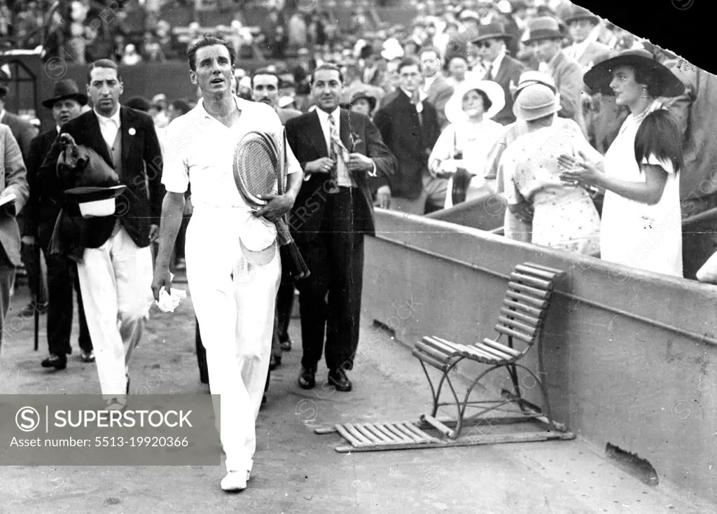 Perry Beats Cocket In Singles Of The Davis Cup Finals.Perry leaving the courts after his victory over dochet. Rene Laceste ex-champion is shown on left. July 20, 1933. (Photo by ACME News Pictures, Inc.).