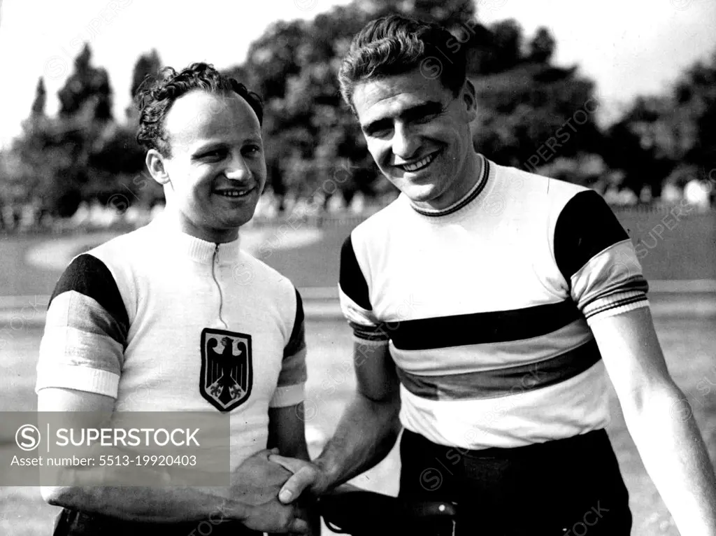 Great Britain V. Germany Professional Cycle Racing and Olympic Trials at Herne Hill:Sid Patterson, the popular Australian Rider, being congratulated by German Sprint Champion, Warner Potzernheim after Patterson (right) had broken the half Mile unpaced flying start record by 8 of a second established by Reg Harris on the track in 1949.Australian professional cyclist Sid Patterson is congratulated by German sprint champion Werner Potzernheim after Patterson has broken the half-mile unpaced flying start record by 8 sec at Herne Hill, London. May 17, 1952. (Photo by Paul Popper).