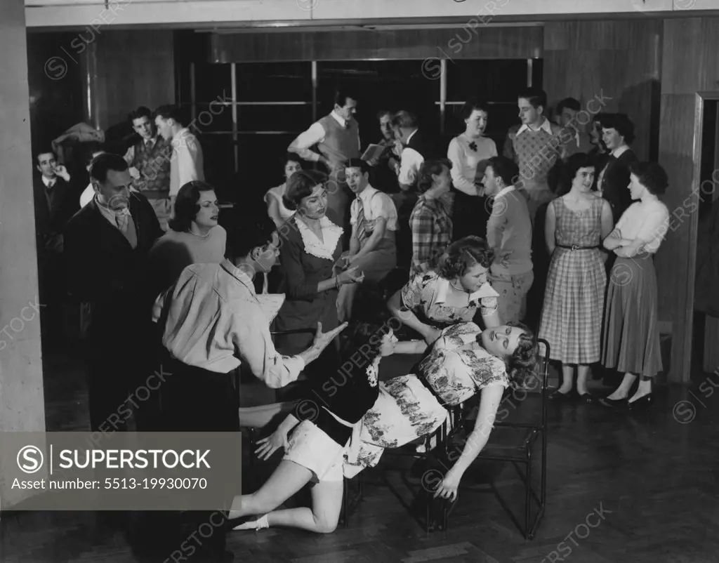 Rehearsal scene for forthcoming production.Members, of the New South Wales Theatrical Society being coached by producer 'Regan for the pantomime, Sinbad, staged last October in Sydney. January 13, 1954.