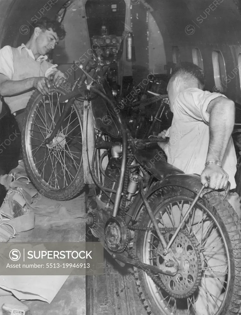 Air Cargo Charter worker G. Clayton (Left) and R. Smith coaching motorcycles on to the Lodester Aircraft which will fly them to Adelaide for the tests there. February 01, 1951.
