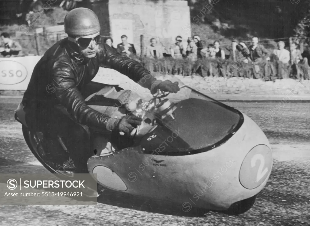 Italian Challenge in T.T. RacesDuillo Acostini, a member of the Italian Guzzi team, at speed on a Junior 350 ***** Guzzi during practice on the T.T. course on the Isle of Man in readlness for next week's races. June 3, 1955. (Photo by Central Press Photos).