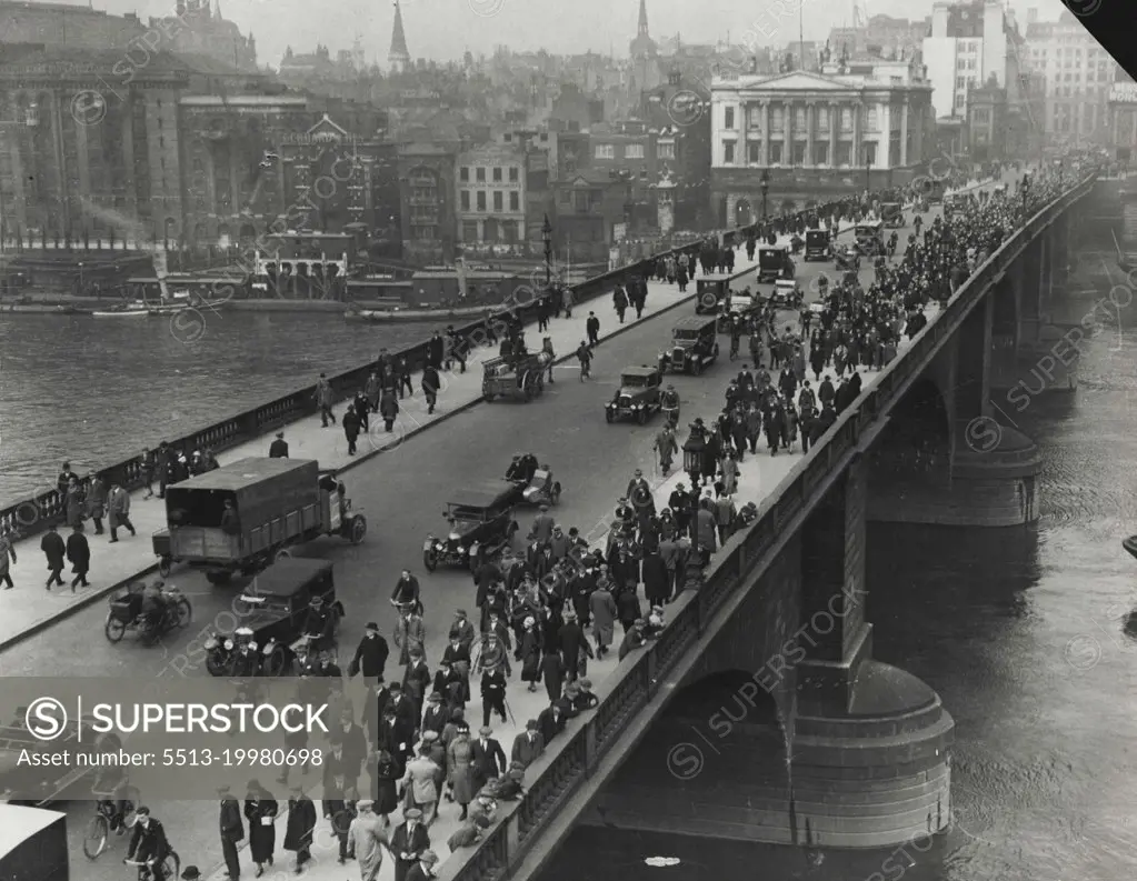 The General Strike -- How thousands of people walked to walk in the City. A scene during the great strike, showing hundreds walking to work across one of London's main bridges. August 3, 1936.