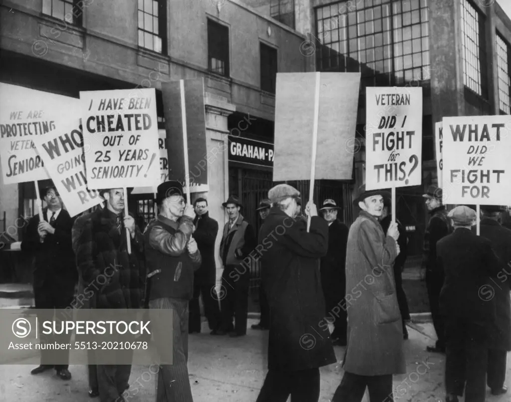 Auto Production At Willow Run Delayed: Graham-Paige Motors Corp. Employees picket the Auto plant today demanding assurance that seniority rights be protected when the transfer of operations to Willow Run is completed. The Bomber plant has been leased for production of the Frazer and Kaiser automobiles. November 26, 1945. (Photo by AP Wirephoto).