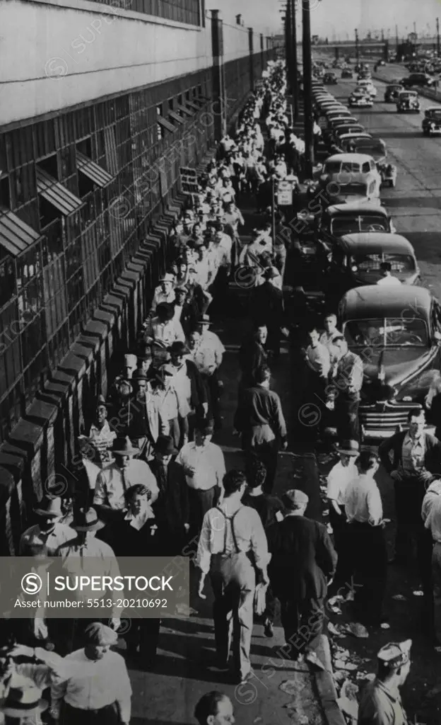 Continuous Line of Pickets At Ford's Rouge Plant -- UAW - CIO strikers picker ford's Rouge plant in one continuous line this morning. Some 65,000 workers today began the second day of the walkout idling production at the Rouge and Lincoln plants. May 6, 1949. (Photo by AP Wirephoto).