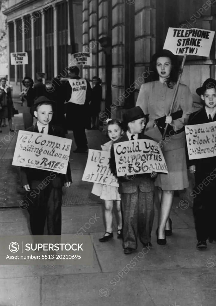 Kids Join Mom On Picket Line -- Pretty Mrs. Gery LaBaugh, 27, is joined by her children as she walks in picket line fore telephone exchange here. April 13, 1947. (Photo by AP Wirephoto).