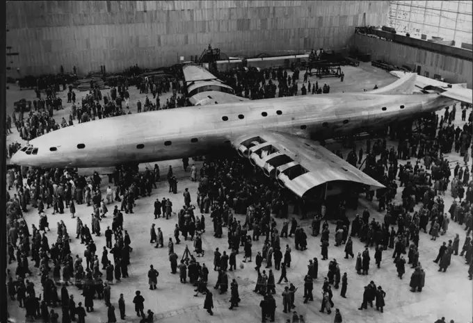 The world's biggest plane, Brabazon 1, dwarfing the crowd at Bristol (England), ***** ceremony. The Brabazon has a fuel capacity of 13,000 gallons, and a wing span of ***** 120 passengers and a crew of 12 and has a maximum speed of more than 300 miles *****. October 9, 1947.