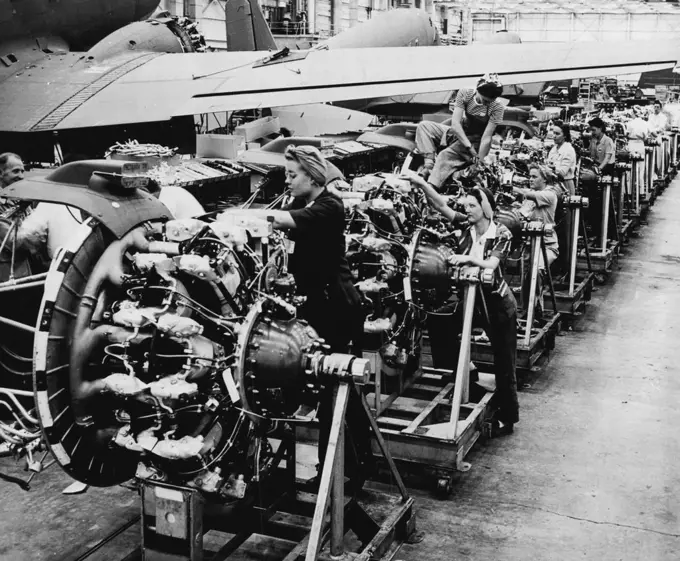 Thousands of women worked in factories throughout the United States helping to build planes and other war machines for World War II. These skilled technicians assembled motors for bombing planes. September 19, 1950. (Photo by United States Information Service).