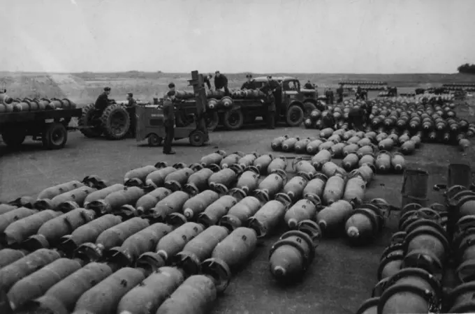 Preparing For R.A.F. Raid On German Fortifications. -- Picture taken at an R.A.F., Bomber Command Station. Loaded bomb trains are leaving the dumps during preparations for another attack in support of the Allied Armies in Northern France. September 4, 1944. (Photo by British Official Photograph).
