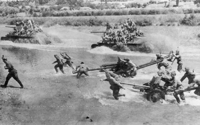 Russian Troops And Armor Cross River -- Russian artillery and tanks cross a river during the assault on German-held Lwow on the first Ukrainian front, according to the caption accompanying this photo, which was received in New York by Radio from Moscow, on July 21. July 21, 1944. (Photo by Associated Press Radiophoto).