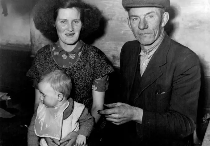 Irish Sheep Farmer Inherits Wolfram Mines -- Sheep-farmer who has inherited. two valuable wolfram mines is 55-year-old Mr. Joseph Higgins, of Valleymount, Blessington, County Wicklow, pictured here with his wife, Mary Margaret, and their 8-months-old son Maurice. Mr. Higgins may soon be going to Australia to see the mines, which became his property when their owner, his brother John James, died last November. John James, who went to Australia 37 years ago, went into the mining business on his ow