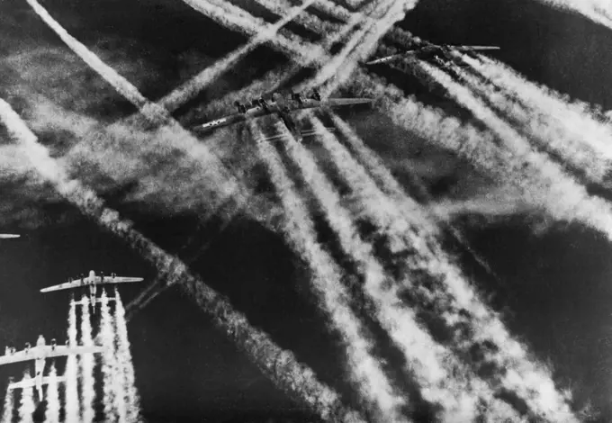 U.S. Bombers Trace Pattern Of Battle Four-motored Flying Fortress bombers of the Eighth U.S. Army Air Force leave four-plumed wakes across the sky over Western Europe during a battle with German fighter planes. The single wakes of the attacking German planes criss-cross the bombers' wakes in a tell-tale pattern of battle. During the month of October, U.S. Fortresses and heavy Liberator bombers operating from bases in Britain shot down 784 German planes, probably destroyed 130 and damaged 347 ov