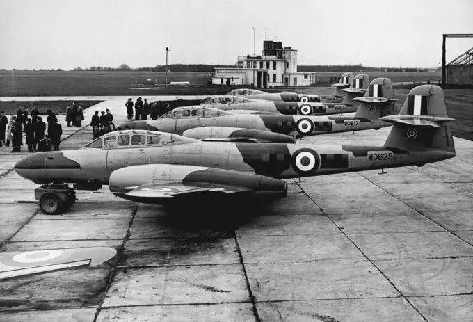 Meteors and Vampires Form Ever-Ready Interceptor Force A group of the Armstrong Whitworth Meteor N.F. 11 jet planes, photographed on the ground before the demonstration at West Malling RAF Station yesterday. Giving a demonstration yesterday at West Mailing RAF Station, Kent., was the first all-weather squadron of jet night interceptors. The planes, de Havilland Vampires and Armstrong Whitworth Meteors converted to carry a navigator and radar equipment, will close the gap in the protective networ