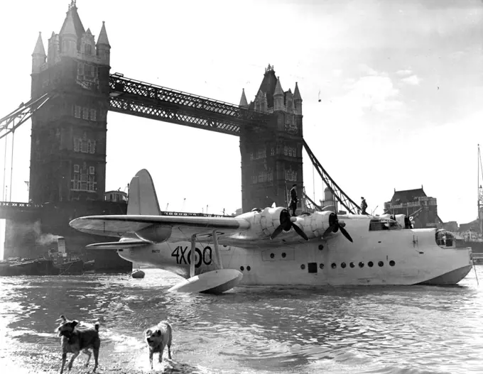 A Giant On The Thames "Battle of Britain" Arrival Londoners and visitors to the metropolis ware amazed to see this huge Coastal Command Flying Boat moored alongside the famous Tower bridge today. It had taxied up the river from Woolwich and will stay moored by the Tower until Sunday for the Battle of Britain celebrations. September 12, 1950. (Photo by Paul Popper Ltd.).