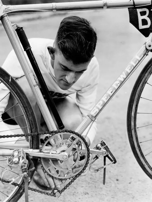 Roy Denny of Dubbo fines bike gears. October 27, 1945.;Roy Denny of Dubbo fines bike gears.