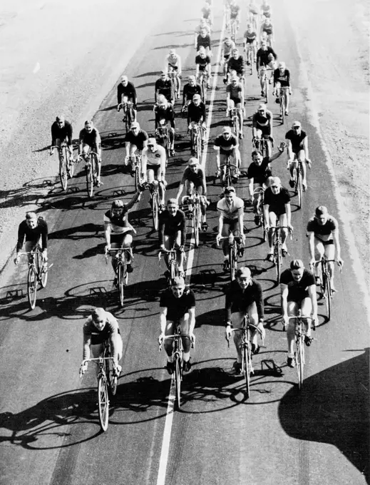 Cheery Enough at the prospect of 104 miles of steady cycling ahead of them. These riders formed the "A" and "B" Grade competitors in today's Melbourne to Wonthaggi road race. September 04, 1939.;Cheery Enough at the prospect of 104 miles of steady cycling ahead of them. These riders formed the "A" and "B" Grade competitors in today's Melbourne to Wonthaggi road race.