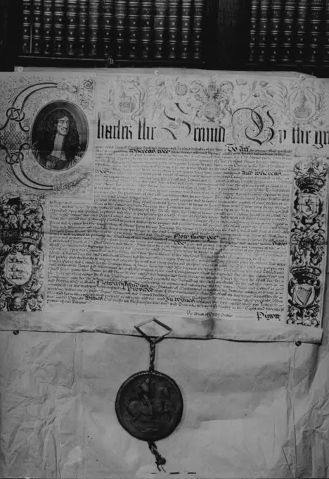 Historical Exhibition at St. Paul's Cathedral to Raise Money For Library Development. A letter, patent to the Dean and Chapter of St. Paul's concerning the building of the Cathedral, from King Charles II, dated 20th February 1677, complete with the Royal seal. September 29, 1949.;Historical Exhibition at St. Paul's Cathedral to Raise Money For Library Development. A letter, patent to the Dean and Chapter of St. Paul's concerning the building of the Cathedral, from King Charles II, dated 20th Feb