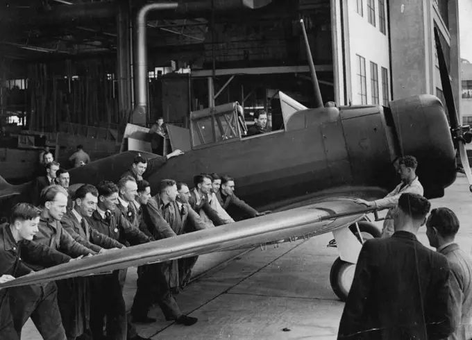 The 100th Australian-made Wirraway being pushed from the factory for its first flight. The first machine was produced 14 months ago. Australia's full order is 811. September 07, 1940.;The 100th Australian-made Wirraway being pushed from the factory for its first flight. The first machine was produced 14 months ago. Australia's full order is 811.