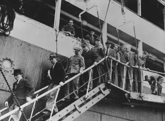 From Russia To A New Life In Uruguay -- The first of the Mennonites leaving to step on Uruguay soil first the first time. Over 1,750 East Prussians, followers of the strict Mennonite religion, have just arrived in South America to take up a new life. 750 of them disembarked from the Dutch liner, Volendam at Montevideo, the remainder continuing the journey to Paraguay. These people lived originally in East Prussia; they moved to Danzig to escape the Nazi persecution, and thence to Russia when the