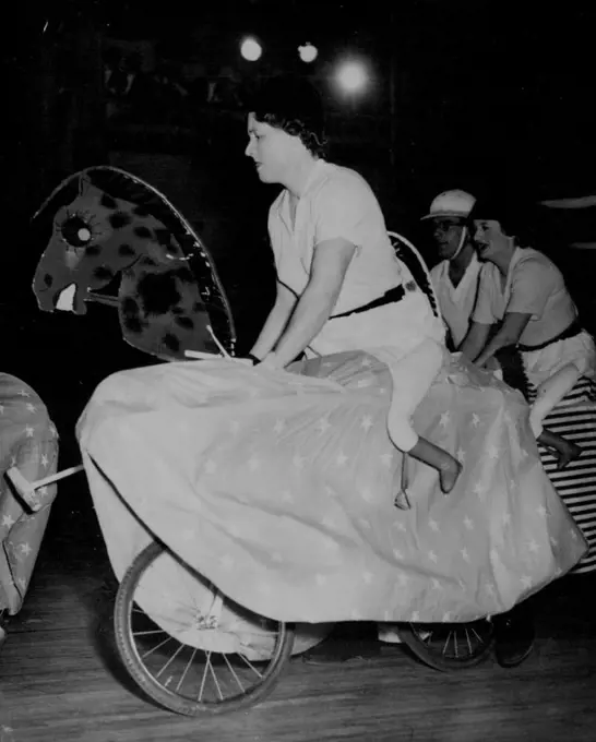 Horse Women Play "Polo" - Making up with their own determination what their mounts lack in grace are horsewomen Pat Smythe (left) and lady Mary Williams, in the thick of an indoor "Polo" match at the lords taverners ball, Grosvenor house, London, October 18. October 19, 1954. (Photo by Associated Press Photo).