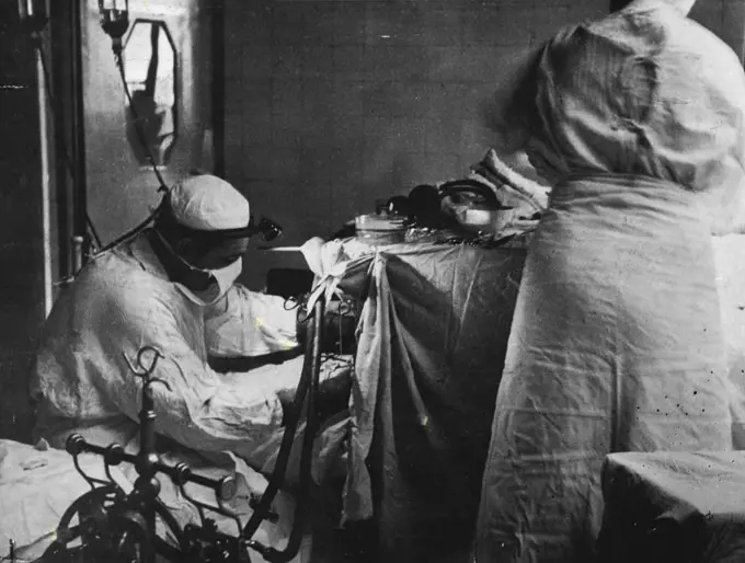 "I felt like a man who had come back from the grave," Winch said after the operation. He had taken so many drugs that extra anaesthetic was needed. A surgeon tackles a recent leucotomy operation in Britain. December 3, 1952.