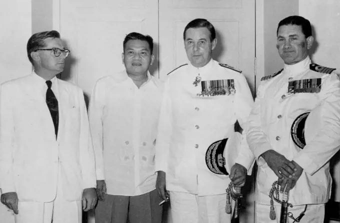 The Australian Ambassador, Mr. K.C.O. Shann, President Megsaysay, Rear-Admiral D.H. Harries, C.B.E., Captain W.H. Harrington, D.S.O. Taken on 22nd October when Admiral Harries, Flag Officer in Command of the Australian fleet called on the president of the Republic of the Philippines, when the SEATO forces participating in Operation "Albatross" visited Manila. November 01, 1955.