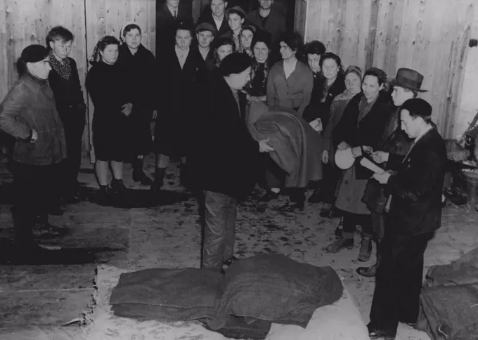 Liberated Russians Sheltered in Belgium -- Liberated Russian workers freed from the Nazi forced-labor system by Allied forces receive blankets and eating utensils March 6, 1945, at an Allied displaced persons' center operated. by the Belgian Government at Namur, Belgium. April 23, 1945. (Photo by U.S. Signal Corps Photo).
