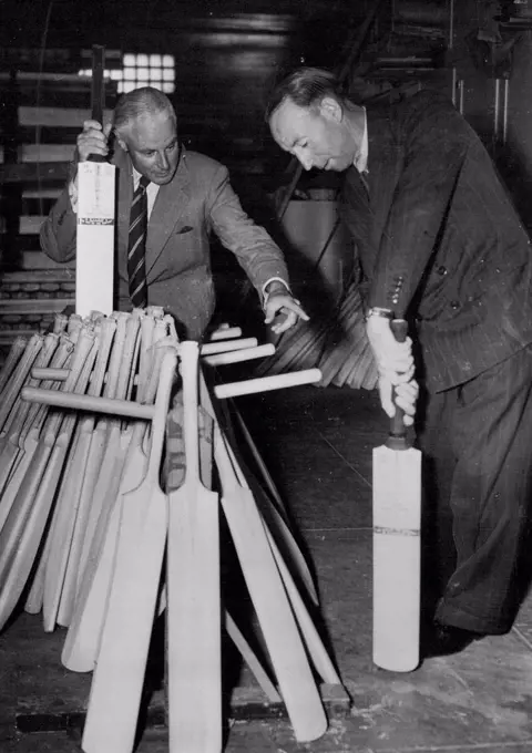 Australian Test captain Lindsay Hassett tests a bat specially made for him with a short handle for balance. Hassett will use the bat in the fourth Test at Adelaide, next month. January 20, 1951.