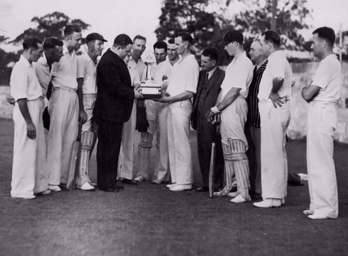 Cricket Trophy Handed Over - Mr. R. Tait, of the Railways Institute over "The Sun" challenge cricket trophy to the Sydney Railways Yard Club. April 08, 1937.