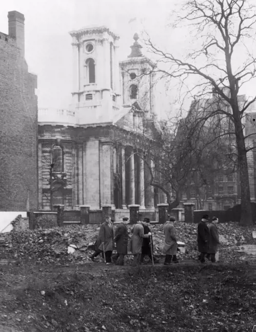 Eight C.I.D. men on the bomb site looking for the scone stone. On a bombed site in the shadows of Westminster the plaque which used to be attached to the Scone Stone was found by a passer by . Detectives then started a search of the site in Smith Square for the missing stone. January 07, 1951. (Photo by Daily Mail Contract Picture).
