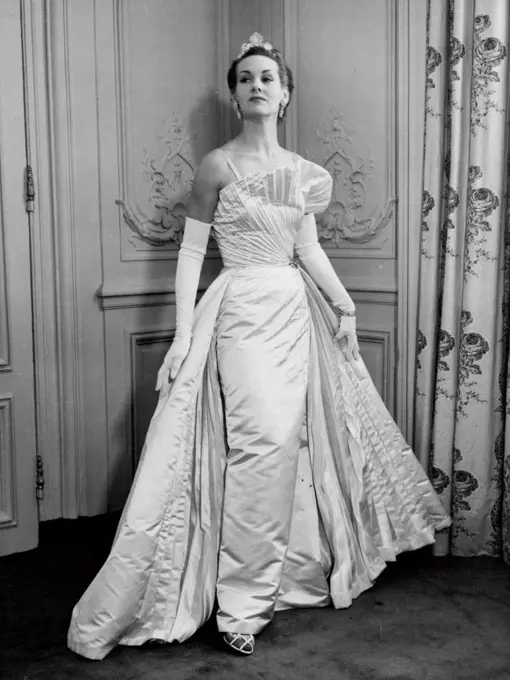 For A Coronation Ball - Stately gown for the ball, to be seen by the Queen in a private showing by the incorporated Society of London Fashion Designers at Claridge's, Mayfair, London, this afternoon (Wednesday). The dress, by Michael Sherard, is in cream British pure silk, duchesse satin. November 12, 1952. (Photo by Reuterphoto).