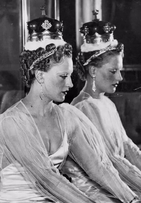 The Official Coronation Hair styles -- These styles have been designed by expert hairdressers under the direction of the incorporated guild of hair dressers, wig makers and perfumers, and are shown in London. Called the curl crown Halo. This style can be worn with Tiara, Coronet, or purely as an evening style. It is seen here worn with a Duchess's Coronet. March 23, 1937. (Photo by Sport & General Press Agency, Limited).