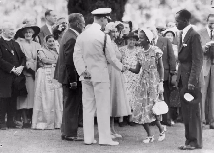 Princess In Nairobi -- Mrs. Nyanjom wife of Mr. ***** Nyanjom, Senior Co-Operative Inspector, being introduced ***** Princess Elizabeth during the Garden Party at Government House, Nairobi, one of the highlights of their Royal Highnesses visits to Kenya. April 02, 1952.