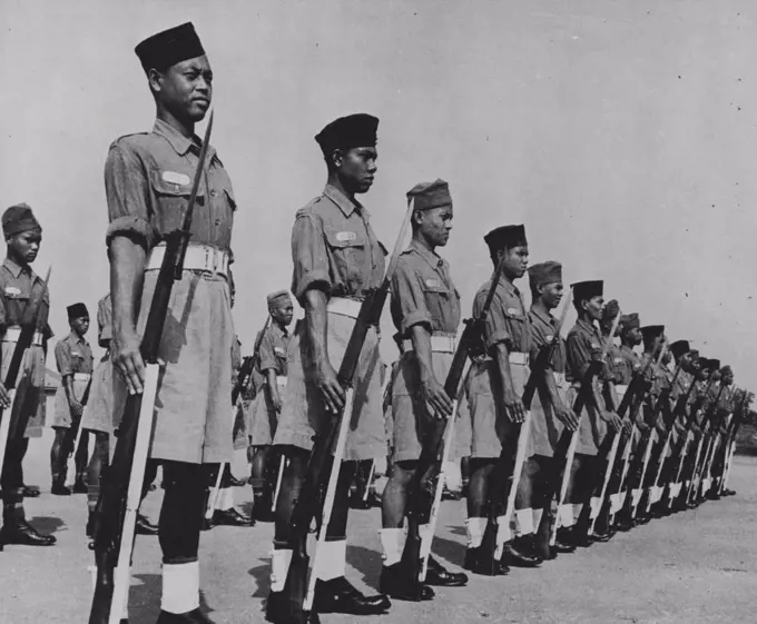 Recruits at musketry drill on the parade ground. May 01, 1950. (Photo by British Official Photograph).
