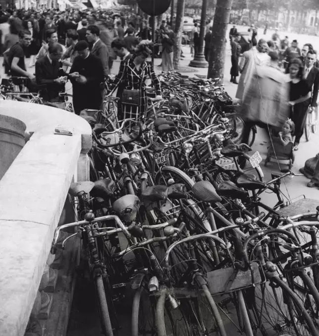 City of Bicycles is Paris today. Thousands of them are parked all over the place, hundreds are purloined daily *****. November 30, 1949.