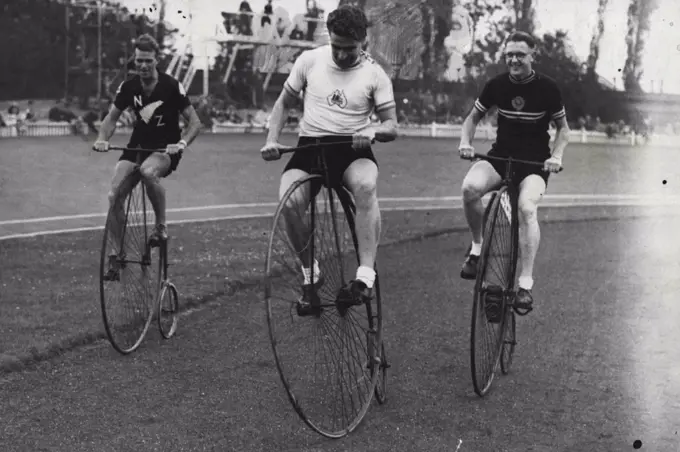 Dominion Riders Try The Old Stagers -- Sid Petterson (centre) of Australia, with A.W. Stonex and A.E. McConnell, the New Zealand riders stage an impromptu race on three of the old "Penny-farthing" cycle, during the Anniversary race meeting on the Herne Hill track, London. September 11, 1948. (Photo by Sport & General Press Agency, Limited).