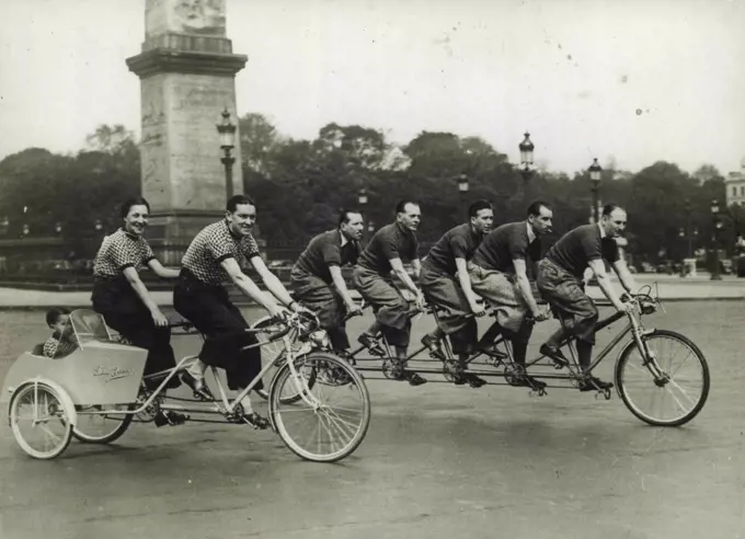 Tandem Day In Paris -- Amongst the numerous entrants in the "Tandem Day" contest in Paris were these two annual cycling combinations. April 15, 1938. (Photo by Sport & General Press Agency, Limited).