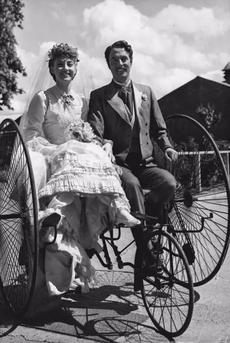 With these old-time two-wheelers -- 'sociables' they called them - one just had to be friendly. Perhaps that is why divorce was so much rarer in the Victorian Days. Here supplying proof that it must have been difficult to go separate ways are Yvonne Marsh and Tom Round. They are jilted bride and 'heartless' defendant in the 'Trial by Jury' sequence from the film 'Gilbert and Sullivan - but there was no keeping them apart when they tried out the 'carriage for two' which London film studios are using at Shepperton to add Victorian authenticity to the production. April 18, 1953. (Photo by Reuterphoto).