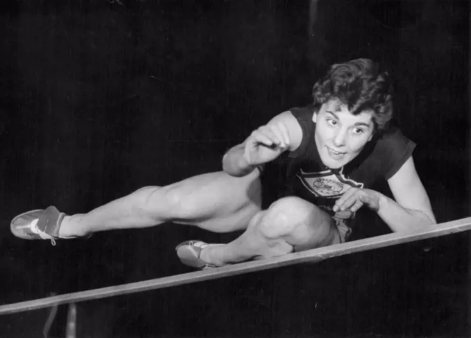 The girl from the drawing office is causing quite a draught as she hurtles over the bar. Pat Robson, who works for a firm of aircraft manufacturers, hopes to be flying even higher than her best yet, 5ft. 2in., on Saturday. She'll be competing in the high jump against the stars of Czechoslovakia in an international Athletic meeting at Manchester - her home town. October 13, 1955. (Photo by Daily Mirror).
