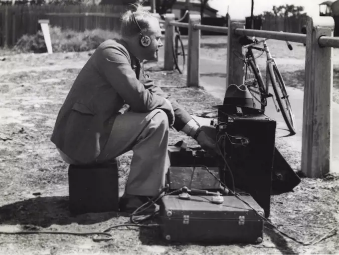 Race broadcasting from Mt. Lawley, Western Australia, a station operator with hastily arranged apparatus. March 7, 1938.