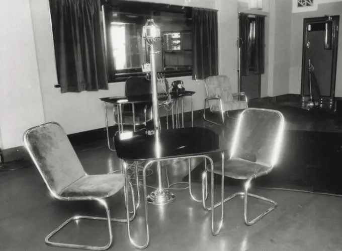 Modern appointments at 2UW's new studio in the state shopping block to the opened tonight steel furniture has pride of place while the 4 way "mike" alows artists performing in plays to group all around the studio with out moving to face the "Mike". October 30, 1933. 