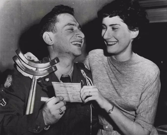 Quiz Prize Wedding Bells - Cpl. Martin Diamant, 22-year-old wounded Korean war veteran, grins happily at his bride-to-be, Rita Spolin, as they hold the $11,840 radio quiz prize check that will make their marriage possible. Diamant, a Brooklyn, N.Y., boy who suffered leg wounds during 14-month service in Korea, took the prize in the "Break The Bank" program, and immediately made plans for the upcoming wedding that hiterto had been postponed due to lack of funds. December 15, 1951. (Photo by AP Wirephoto).
