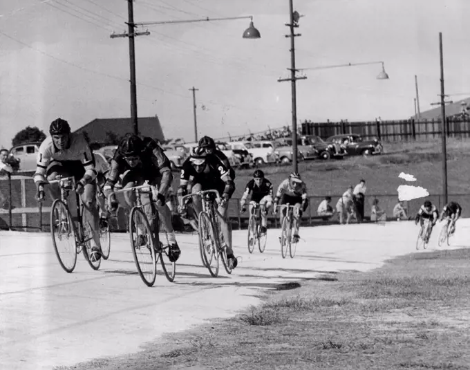 6 day cycle race. Finish of half hourly sprint. Harold Jensen (centre) was first, and Lionel Cox (left) was second. November 20, 1954. (Photo by Wright/Fairfax Media). 