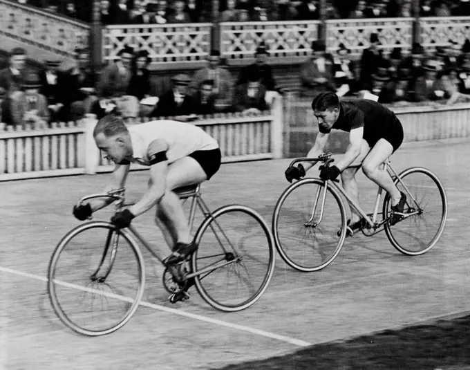 The Cyclists' Grand Prix -- S. T. Cozens (Manchester Wheelers) and J.R. Sanders fighting out their heat of the Grand Prix of London, in which Continental riders took part at Herne Hill this evening. Cozens won the heat. July 13, 1931. (Photo by Central Press Photograph).