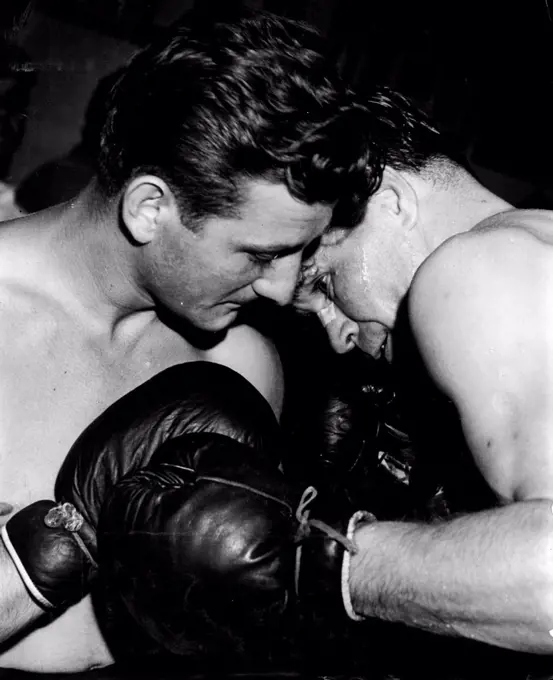 Jimmy Millette (left) boxes with Benny Evans. February 28, 1948.