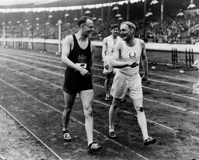 Lord Burghley, winner of the 120 yds hurdles match, talking to (left) H. trossbach berliner S.C who was second. June 27, 1932.