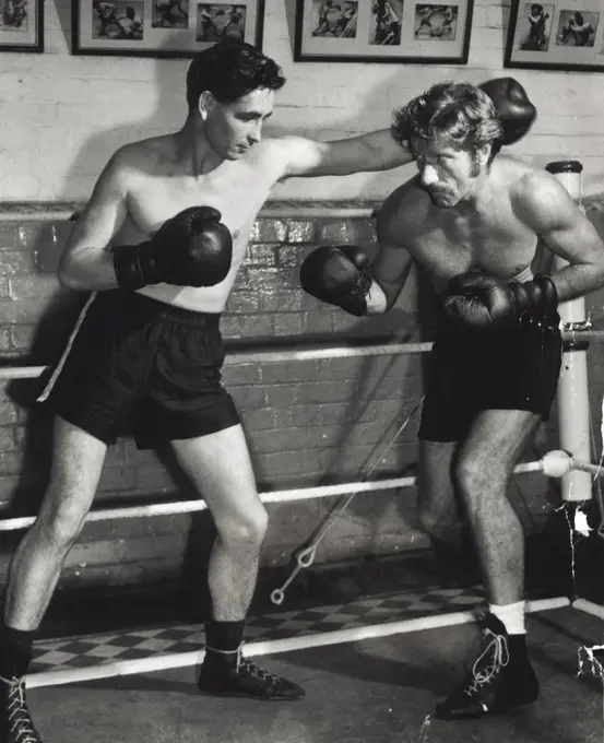 Hollywood star Richard Boone who will appear in Kangaroo Kid had a work-out at the McQuillans Gym with Harry Hayes who lights Irvin Street at the stadium this Monday night. November 27, 1950.